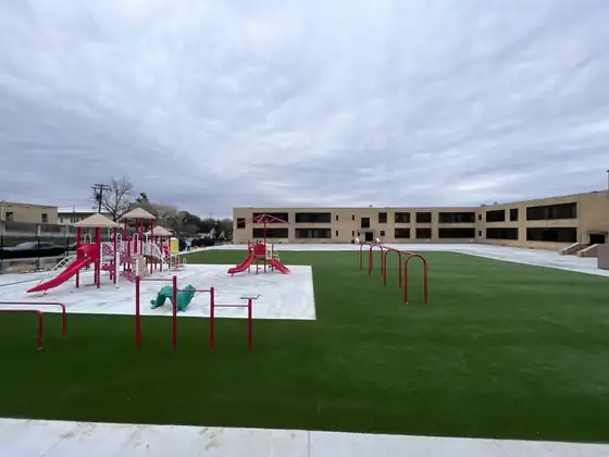 Artificial turf around a playground and fitness equipment